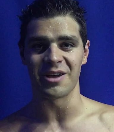 In which stroke did Andrew swim in the Olympic record-holding 4x100 meter medley relay?
