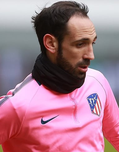 Who was Juanfran's coach during Atlético Madrid's 2014 La Liga win?
