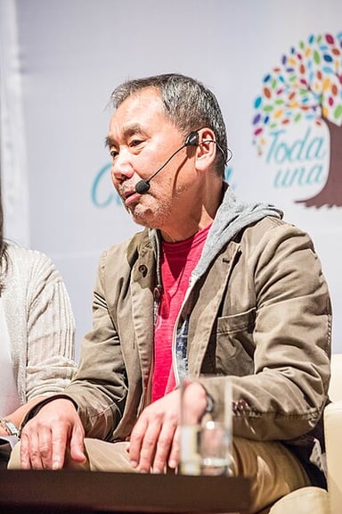 Which city did Haruki Murakami grow up in?