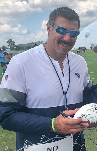 As a player, Vrabel was mainly known for playing which side of the ball?