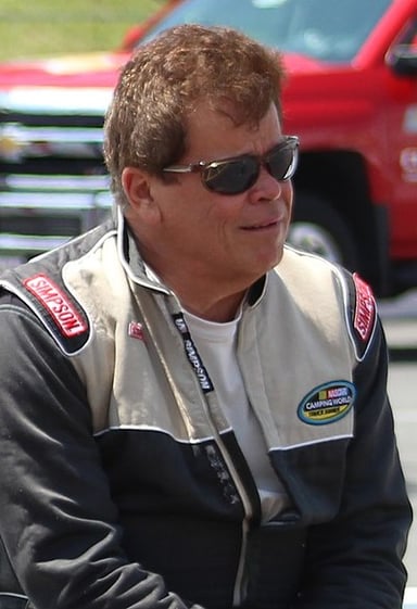What car does Norm Benning drive for his own team?