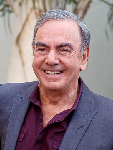 How many songs by Neil Diamond have reached the top 10 on the Billboard Adult Contemporary charts?