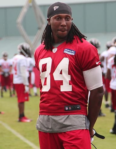 Who did Roddy White score his first NFL touchdown against?