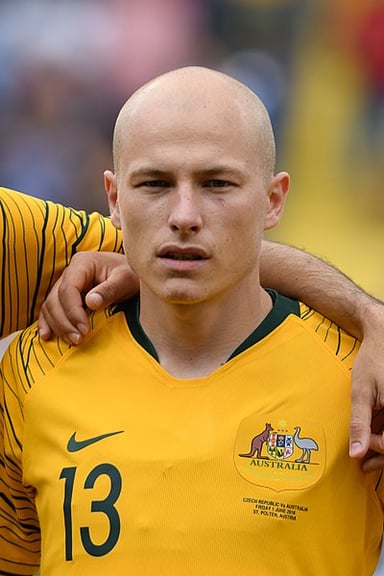Which football event did Aaron Mooy play in twice?