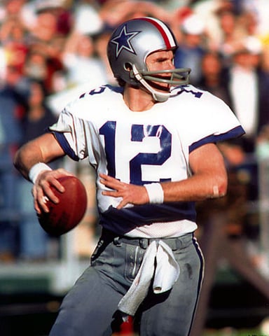 Who holds the record for most passing yards in a single season for the Dallas Cowboys?