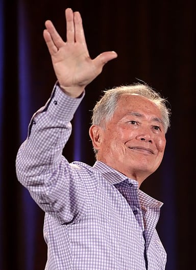 In what language is George Takei fluent besides English?