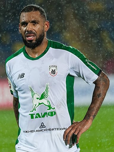 Did Yann M'Vila make his senior debut in a competitive match or a friendly?