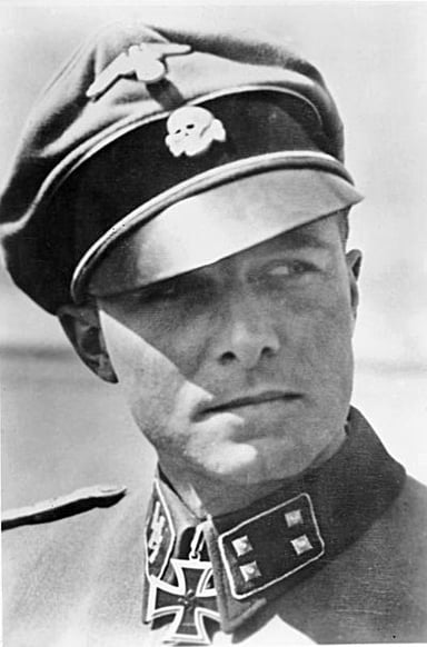 Where did Peiper serve as a Tank Commander in the Waffen SS?