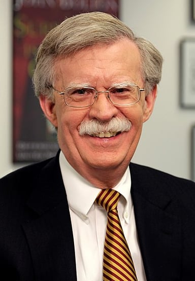 Which presidential candidate did John Bolton serve as a foreign policy adviser to in 2012?
