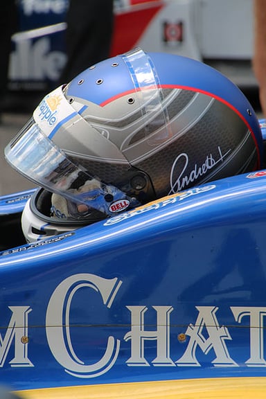 Who is Marco Andretti's father, also a well-known racecar driver?