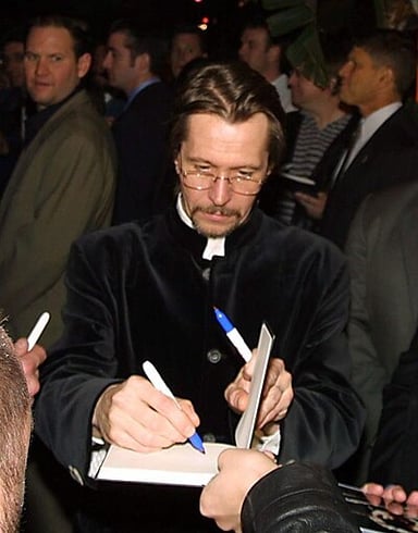 In which year did Gary Oldman begin his acting career in theatre?