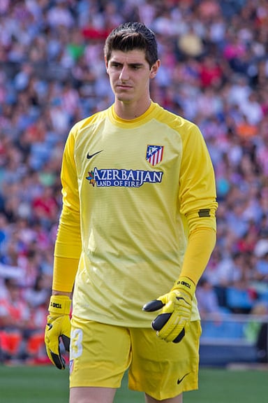 Which trophy did Courtois win with Atlético Madrid in 2013?