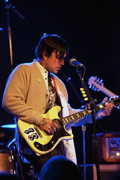 Which band did Frank Iero join in 2002?