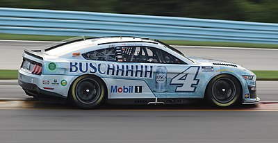 What car number does Kevin Harvick drive in the NASCAR Cup Series?
