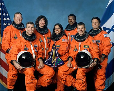 When did Kalpana Chawla first fly on Space Shuttle Columbia?