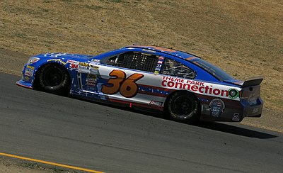 Which two car numbers did Reed Sorenson drove for Spire Motorsports?