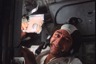 On Apollo 17, who were Evans' crewmates?