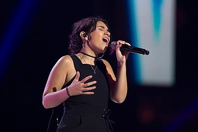 Which record labels did Alessia Cara sign with in 2014?