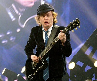Which signature move is Angus Young famous for performing?