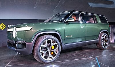 What is the estimated range of Rivian's R1T pickup truck?