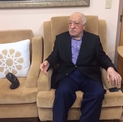 Which country issued an arrest warrant for Gülen?