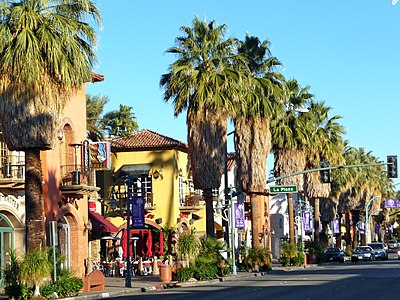 When does Palm Springs' population typically triple?