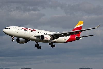 Which airline did Iberia merge with in 2010?
