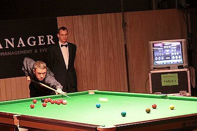 Who surpassed Stephen Hendry's record of seven world titles?
