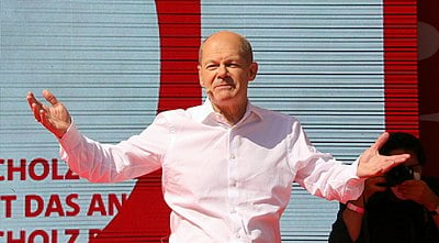 What was Olaf Scholz's role in the First Merkel Government?
