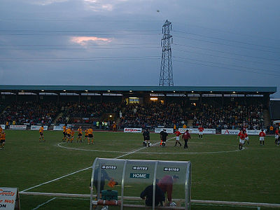 In which year did Newport County A.F.C. lose their Football League place due to a double relegation?