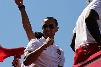 Which tournament did Walcott represent England at in 2006?