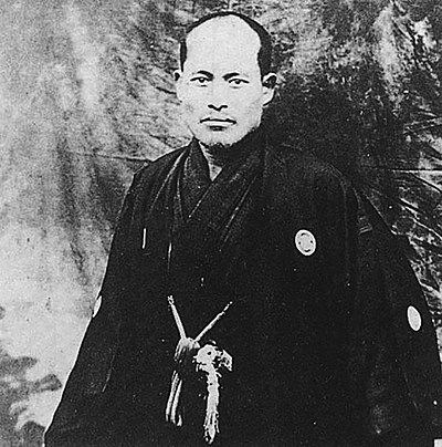 Who was the martial artist Ueshiba met in Hokkaidō?
