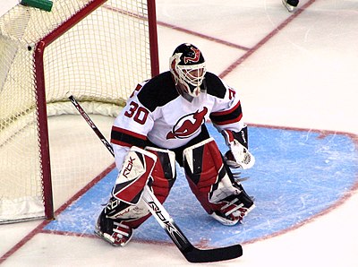 In which year was Brodeur named one of the "100 Greatest NHL Players"?