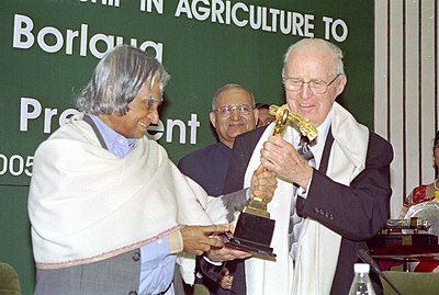 In which country was M.S. Swaminathan key in promoting high-yielding varieties of wheat and rice?