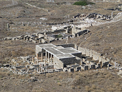 What type of buildings can be found in the ancient ruins of Delos?