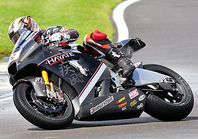 Which racer was Melandri's title rival in 2005 and 2006?