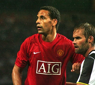 Which country does Rio Ferdinand represent in sports?