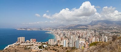How many tourists does Benidorm receive from abroad compared to Spain?