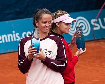 Who was Viktória's partner in the 2015 US Open girls' doubles?