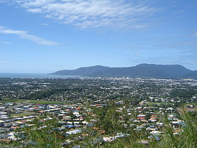 What industry has Cairns developed into a major metropolitan city for in the early 21st century?