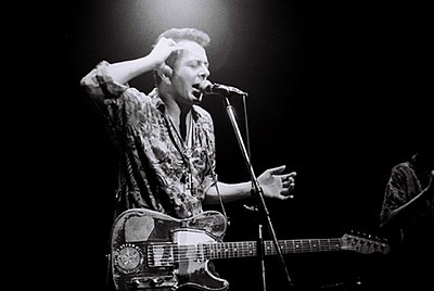 In which band did Joe Strummer serve as co-founder, lyricist, rhythm guitarist, and lead vocalist?