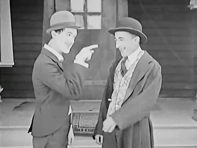How do people remember Stan Laurel's comedy?