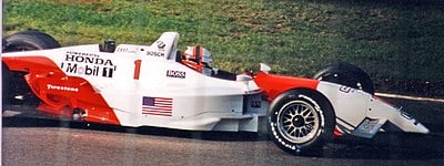 Before Champ Car, in which series was de Ferran a regular competitor?