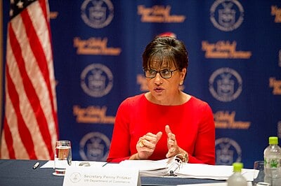 What is the name of the real estate investment firm Penny Pritzker co-founded?