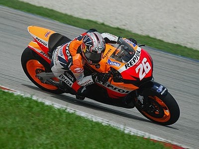 In which Grand Prix did Dani Pedrosa return as a wildcard rider for KTM in 2021?
