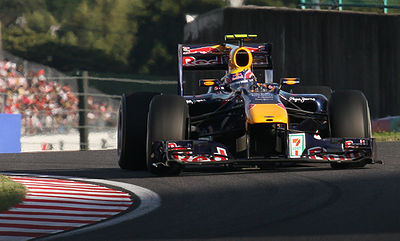 In which year did Mark Webber achieve his first Formula One podium finish?