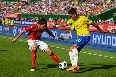 In which year did Firmino make his international debut for Brazil?