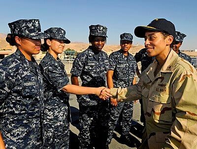 In which year did Michelle Howard retire from the United States Navy?