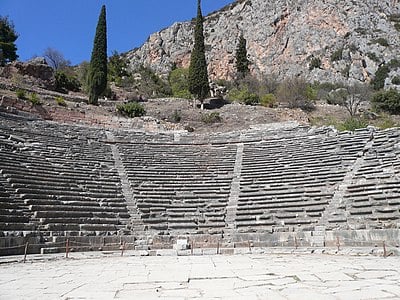 What was the main material used for constructing the monuments at Delphi?