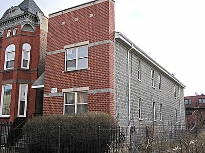 Where was Hampton's apartment located where the fatal raid occurred?